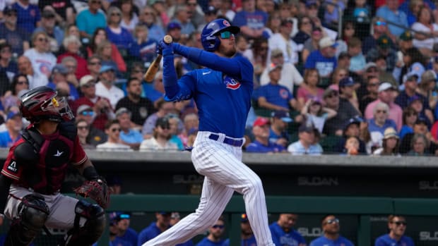 Mar 16, 2023; Mesa, Arizona, USA; Chicago Cubs center fielder Cody Bellinger (24) hits against the Arizona Diamondbacks in the third inning at Sloan Park. Mandatory Credit: Rick Scuteri-USA TODAY Sports
